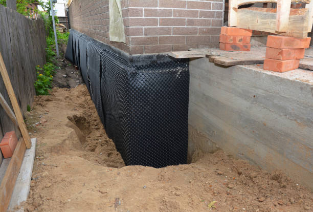 SJ Waterproofing Pros technician performing targeted Vapor Barrier Installation assessment in Forestville, WI
